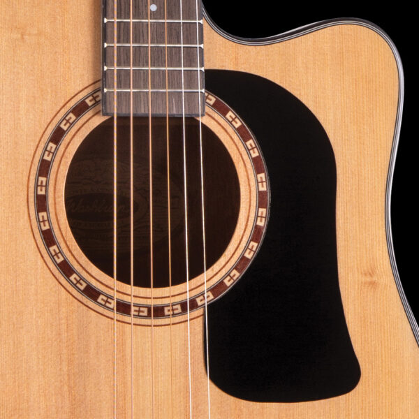 closeup of rosette on acoustic guitar