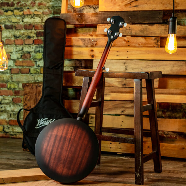 back view of banjo leaning on stool with gig bag in background