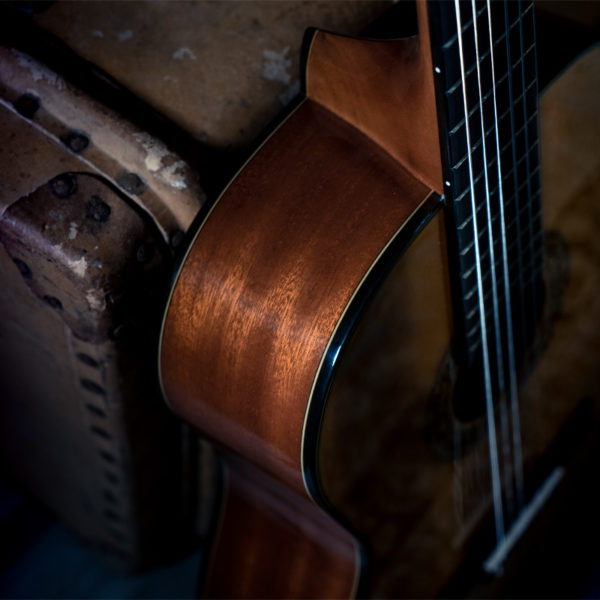 angled top view of Washburn acoustic guitar