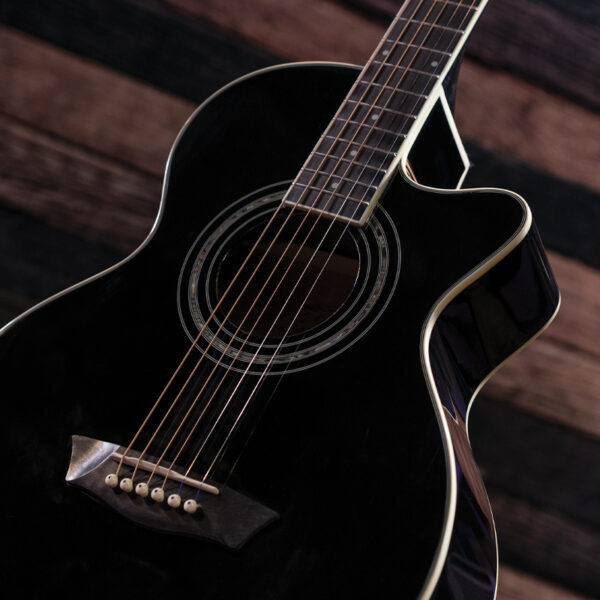 body of black acoustic guitar