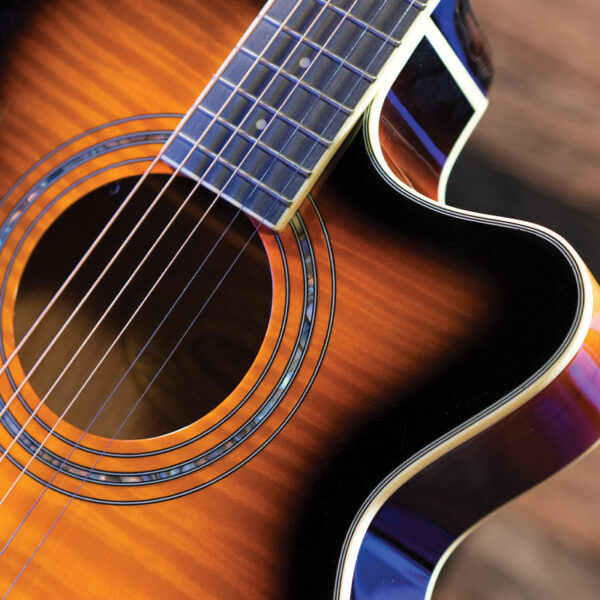 closeup of rosette on yellow acoustic guitar