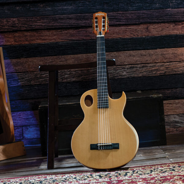 Washburn guitar leaning on stool