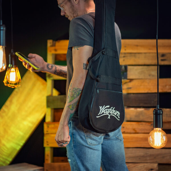 man carrying Washburn gig bag