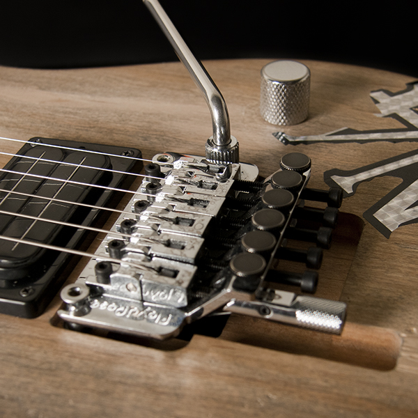 closeup of bridge and saddles on Washburn electric guitar