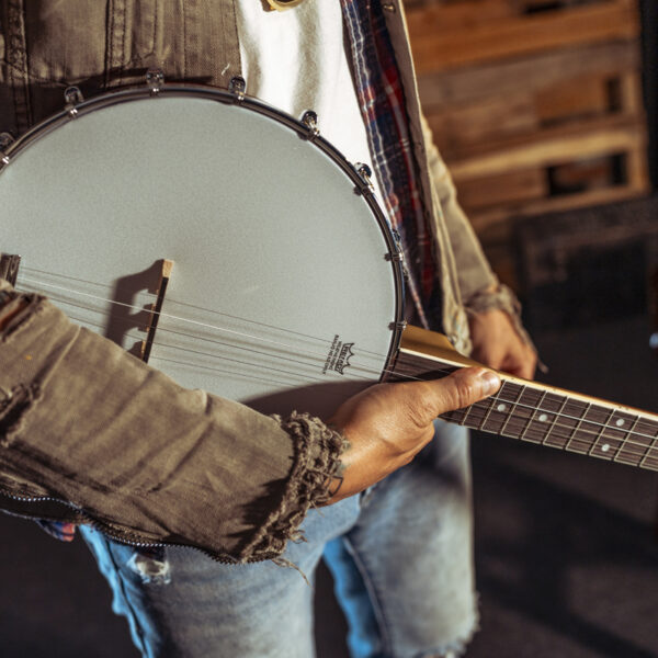 image of a man holding a Washburn B7 Banjo